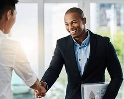 person giving a handshake to another person