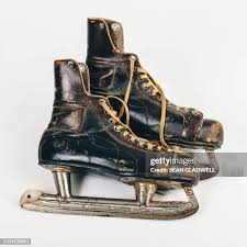 Ice Skates Hanging By Laces High-Res Stock Photo