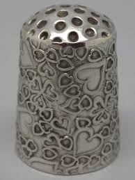That thing you put on your finger when sewing. Pin On Fingerhute