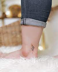 This tattoo is as feminine and dainty as it gets. Cute And Feminine Tiny Tattoo Ideas