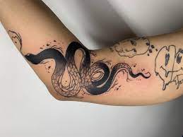 Symbols or text are the most popular designs, reminding the person of the people and the things that are most important to him. Simple Black Snake Done By Tacho Oni Tattoo In Alhambra Ca Tattoos