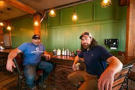 Aaron and Chase Lesher assembling the distillation equipment.