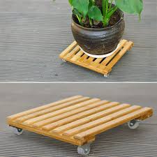 The unho wooden plant stand comes with six layers, which allows you to display your plants or flowers correctly. Heavy Duty Wooden Plant Caddy With Roller Wood Plant Pot Base Roller Moving Tray Plant Pot Trolley Mover On Wheels Planter Stand With Wheels Buy Online In Tanzania At Tanzania Desertcart Com Productid