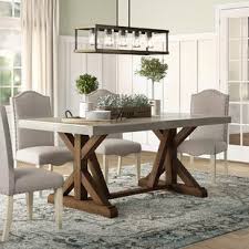 Crafted from reclaimed wood, this table from our bartol collection has angled legs, a stretcher bar and a rustic finish with a rich depth of color. Narrow Dining Table Birch Lane