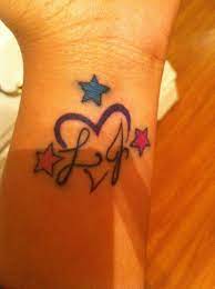 Initial tattoos can express strong emotions and deep love and … 69 Suave Tattoos With Hearts And Initials