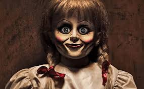 Lorraine poses next to the doll inside the warrens' occult museum in more recent years. Fact Check Annabelle Doll Did Not Escape Warren Museum Truth Here Ibtimes India