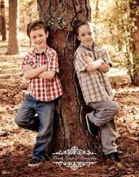 Beautiful swings will be a great idea and location for a photoshoot of a pregnant woman. Fall Twin Boys Pose Idea C Charitygoodwinphotography Children Photography Siblings Photography Poses Family Children Photography