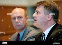 Center County, Pa., District Attorney Michael Madeira, right, speaks during  a news conference with State College chief of police Tomas King, left, as  they outline charges against 10 men including 6 Penn