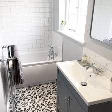 White or black, placed in a splashback, in the shower here are some decor ideas to adopt the metro tiles on your walls. Grey Bathroom White Metro Tiles With Black And White Floor Tiles Photo By Poms Abode White Bathroom Tiles Patterned Floor Tiles Patterned Bathroom Tiles