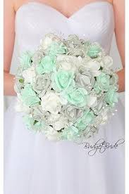 Below is a live look at how mint, green flowers are used in floral estimates by lobiloo users. Mint Green And Grey Theme Wedding Flower Bouquet With Mint Green Grey And White Roses With Je Mint Bouquet Wedding Wedding Mint Green Mint Green Wedding Theme
