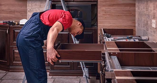 Chislehurst storage solutions specialist assembling modular shelving and media cabinet unit