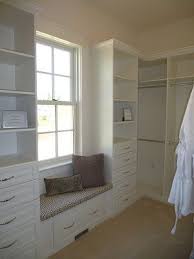 The details in this closet are what make the space, the trim work, built in window seat, and don't forget the lighted wardrobe with glass front doors! Pin By Ana Maria Contreras On Walking Closet Home Master Bedroom Closet Closet Design