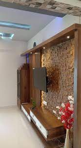 Anchor your living room or den with this beautiful stone finish piece paired with two bookcase piers on either side to create a wall unit that is sure to make. Stone Cladding Tv Unit Design Wall Tv Unit Design Modern Tv Unit Designs Modern Tv Wall Units
