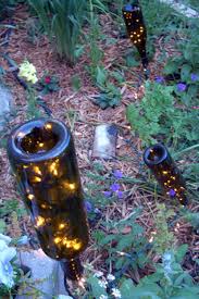 Fill the empty bottle with water and a few drops of dish soap, close it, then shake it. Wine Bottle Garden Crafts How To Use Recycled Bottles In Your Yard