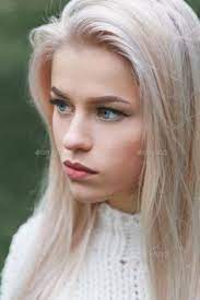 Portrait Of A Beautiful Serious Blonde Girl In A White Knitted Sweater Close Up Profile Blonde Girl Photography Blonde Girl Blonde Beauty