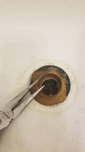 Excess amount of chemical drain cleaner can cause damage to. How Do I Remove This Old Tub Drain Center Broke Apart Easily Plumbing