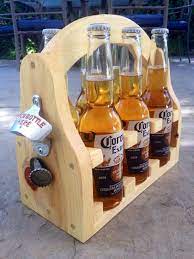 All you need is a wooden board, a wall mounted bottle opener, a handle and screws. Pine Beer Caddy Beer Caddy Woodworking Plans Diy Small Wood Projects