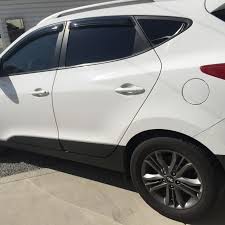 The average selling price of this vehicle on carfax is $15,043. Look At This 2015 Hyundai Tucson With Our Mind Blowing Window Tint Tinted Windows Hyundai Tucson Commercial Window Tinting