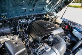 Transfer case adapter, oil pan, headers and motor mounts. Chevy 6 2l L92 V8 Land Rover Defender 110 E C D Automotive Design