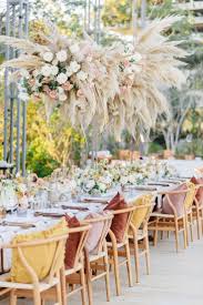 A New Wedding Trend Is Having Your Wedding Table Centerpieces High Allowing Your Guests To Winter Wedding Destinations Winter Wedding Table Oceanfront Wedding