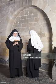 Two Nuns In An Old Convent Stock Photo - Download Image Now - Nun, Praying,  Convent - iStock