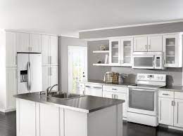 Modern classic kitchen interior with kitchen appliances and white ceramic sink with gold mirror faucet on wood top with marble wall in the background / kitchen interior. Modern Kitchen Design With White Appliances Novocom Top