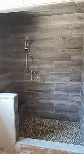 Cool Wood Grain Porcelain Shower And River Rocks Stephen Belyea Ma Bathroom Remodel Shower Farmhouse Shower Shower Remodel