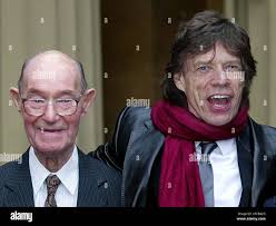 FILE ** Member of the Rolling Stones rock band, Sir Mick Jagger, 60, right,  stands with his father Joe, in this file photo dated December 12, 2003, in  London. Joe Jagger