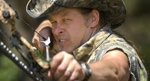 Ted Nugent takes aim with a hunting bow for a photo on his ranch near Crawford - 09_ted_nugent_605_ap_605