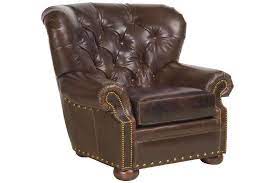 Smooth, tufted bonded leather chair with tapered legs. Hadley Button Tufted Leather Chesterfield Club Chair