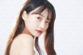 A woman standing in front of a building photo