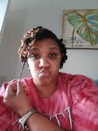 Passport photo with styled locs and makeup