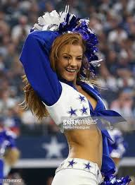 A Dallas Cowboys Cheerleader Performs During The Game Against The New Dallas Cowboys Cheerleaders Dallas Cowboys Cheerleading