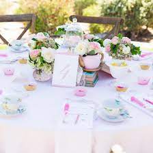 The cute white gable favor boxes with a face card attached. A Beautiful Tea Party Baby Shower Fun365