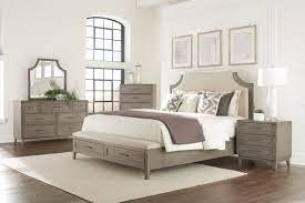 Gorgeous grey washed furniture displayed as focal points in a room is a hot new trend! Riverside Furniture Vogue 4pc Upholstered With Storage Bedroom Set In Gray Wash