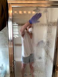 How To Remove Hard Water Stains From Glass Shower Doors The Forked Spoon Hard Water Stain Remover Cleaning Hacks Deep Cleaning Tips