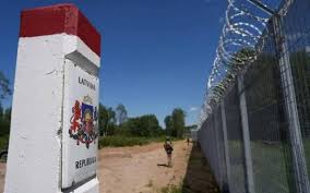 Latvia stopped over 12,000 people before any EU quota applied. That is the figure Braže gave for Latvia's frontier with Belarus, and the fence along it is now finished. She thanked the
