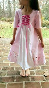The design uses inspiration from. The Merry Church Mousegirls Dress Patternsthe Anneliese Dress