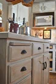 Upper cabinets take a lot less abuse than base cabinets, and therefore a new paint job will last longer. 39 Shabby Chic Whitewashed Storage Pieces Digsdigs Stained Kitchen Cabinets Whitewash Kitchen Cabinets Kitchen Remodel