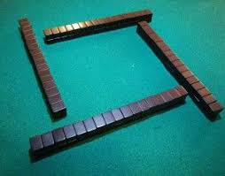 Una vez situadas boca abajo todas las fichas sobre la mesa, . Jugar Al Mahjong
