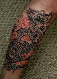 Two black koi fish tattoo on the left inner arm. 35 Dragon Tattoos On Forearm