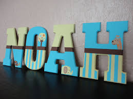 The alphabet written in yellow text on asphalt. Hand Painted Wooden Letters Summer Infant Giggle By Wallapproved 8 00 Painting Wooden Letters Wooden Letters Painted Wood Letters