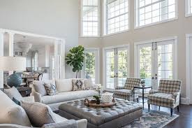 Transitional Living Room In A Two Story Home Featuring A Large Gray Leather Tufted Living Room Leather Transitional Decor Living Room Transitional Living Rooms