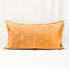 Place throw pillows on a bare sofa to spruce up the furniture's design. King Size Merzouga Cactus Silk Pillow Apt F