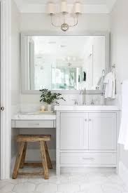 Charming White And Gray Bathroom Boasts A Rustic Wood Stool Placed On Large White Marble H Cheap Bathroom Vanities Guest Bathroom Remodel White Vanity Bathroom