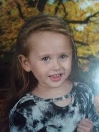 Non-verbal 8-year-old girl with communication tablet