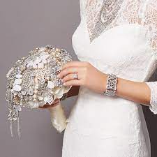 Learn all about the bridal bouquet tradition and its meaning straight from an expert. This Amazing Wedding Bouquet Is Made Entirely Of Charming Charlie Jewelry And Hand Crafted By Theritzyrose Wedding Dresses Wedding Wedding Inspiration