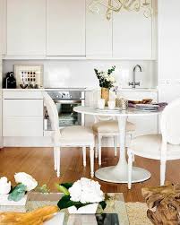 A thick 12mm clear, round glass top completes the piece to make a small dining table. Loving Lately Saarinen Tulip Tables Shannon Claire