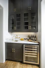 Black Wet Bar Wine Fridge White Subway Tile Backsplash Black Cabinets With Brass Hardware Gold Hardware Aged Kitchen Wet Bar Wet Bar Home Bar Designs