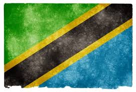 National flag consisting of triangles of green and blue separated by a black diagonal stripe with yellow fimbriations (narrow borders). Tanzaniya Granzh Flag Besplatno Foto